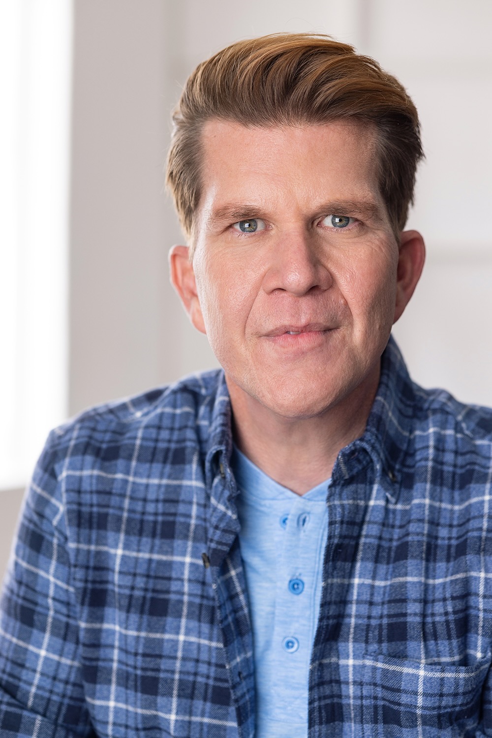 Jonas Åsberg character-style headshot with relaxed smile.